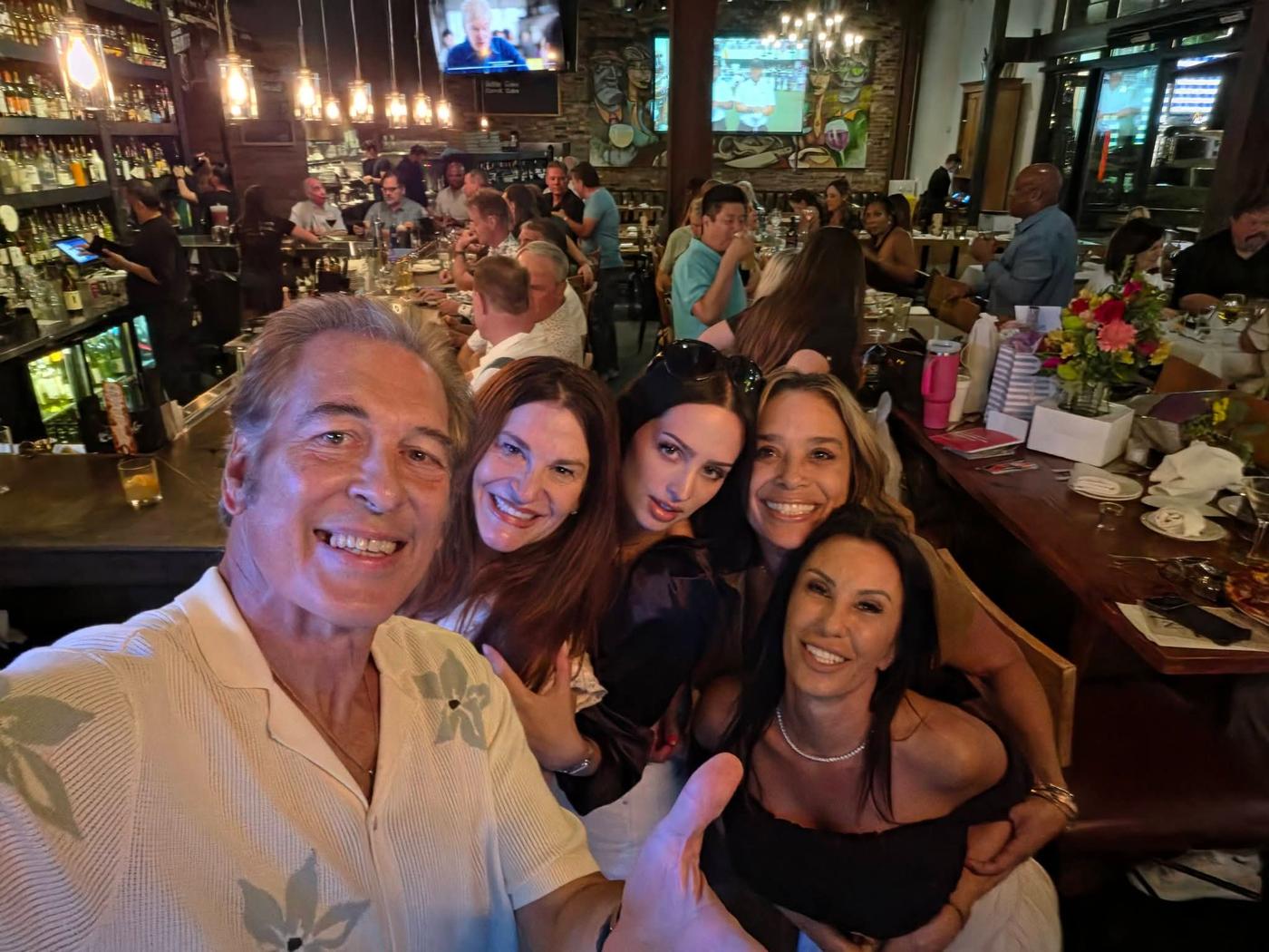 Craig and friends taking a lively group photo at the venue